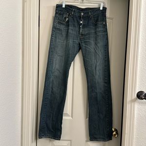Levi’s 501 size 33. Wear around back pocket and at bottom right back leg.